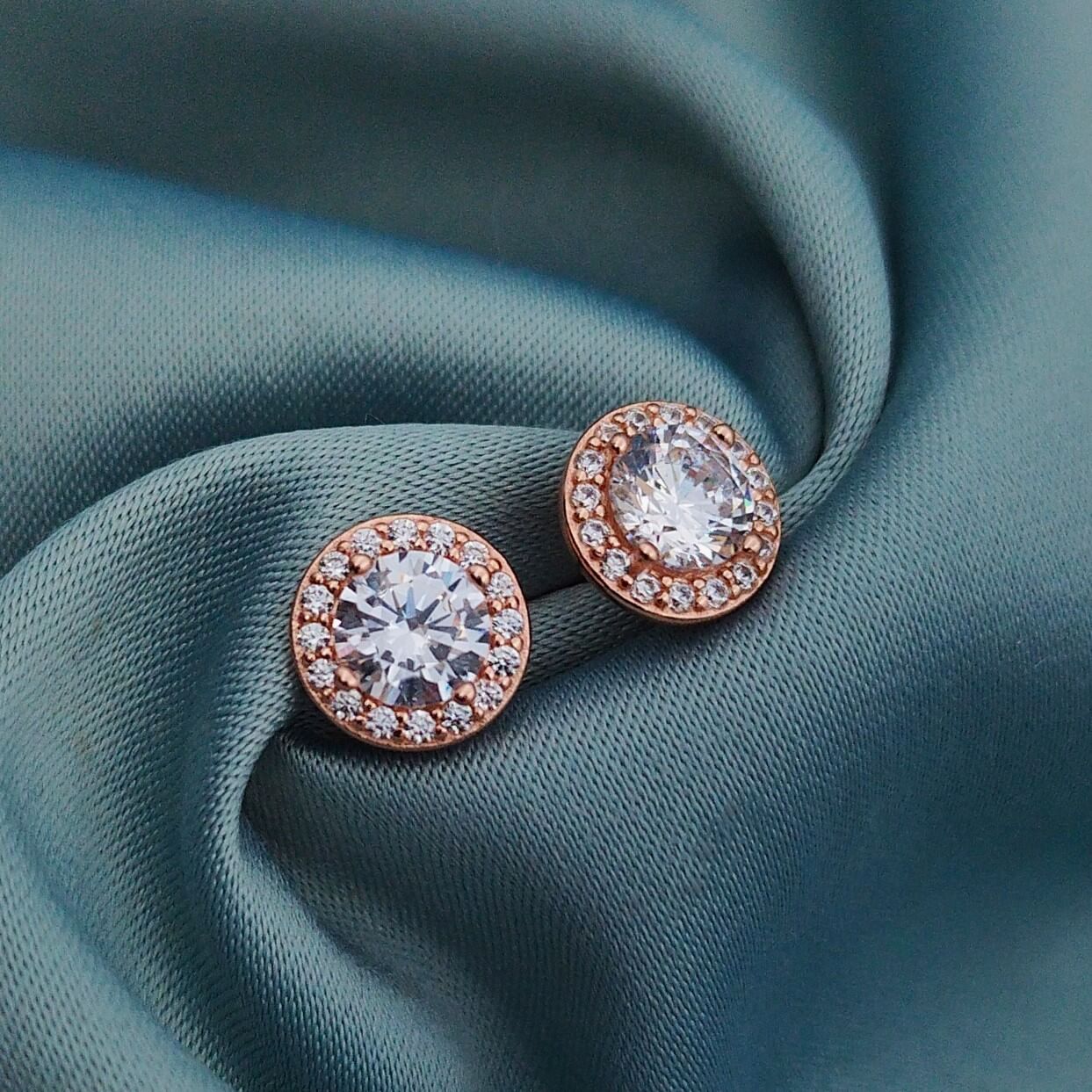 Aretes circón redondo con halo rosé