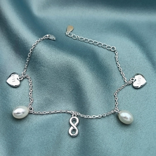 Pulsera dijes corazones infinitos y perlas
