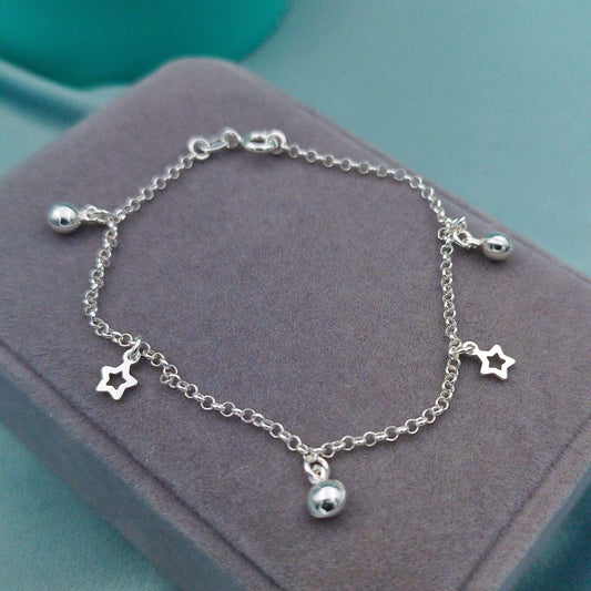 Pulsera dijes llamador y estrellas caladas