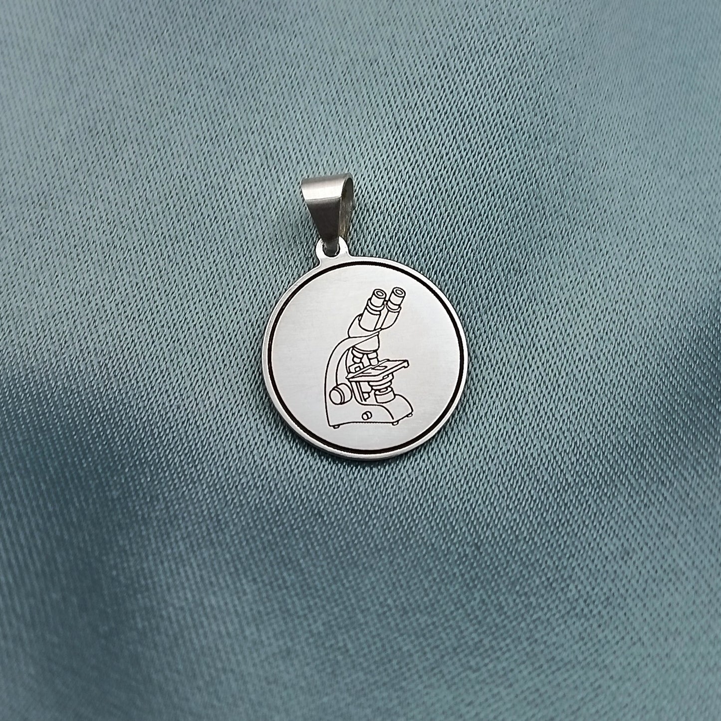 Dije placa redonda 1.5cm con grabado
