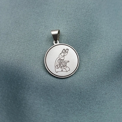 Dije placa redonda 1.5cm con grabado