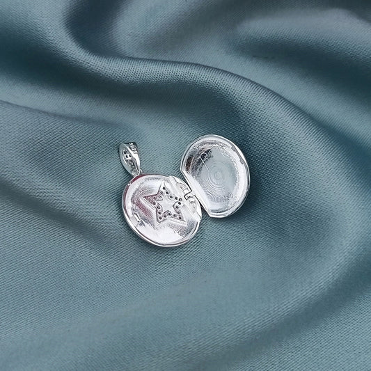 Dije Relicario Redondo Estrellas